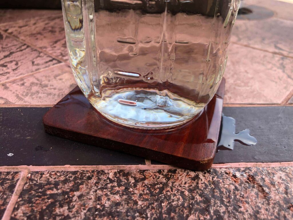 Non Absorbent Coaster Spilling Onto Furniture Non Absorbent Coaster Spilling Onto Furniture