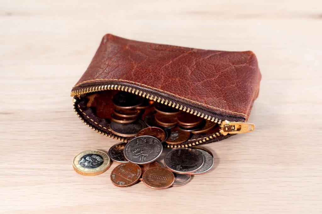Coins inside this red leather coin case with zipper Coins inside this red leather coin case with zipper
