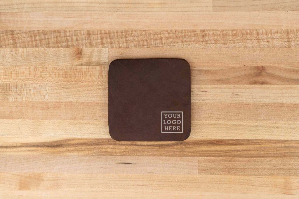 Debossed Custom Logo On Each Square Leather Coaster. Debossed Custom Logo On Each Square Leather Coaster.
